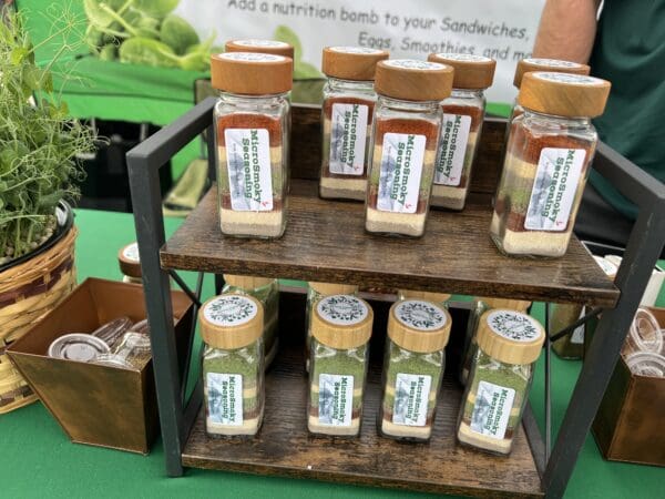 A display of spices on two shelves.